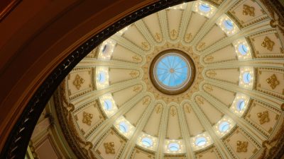 Ornate interior dome ceiling of the California State Capitol in Sacramento.